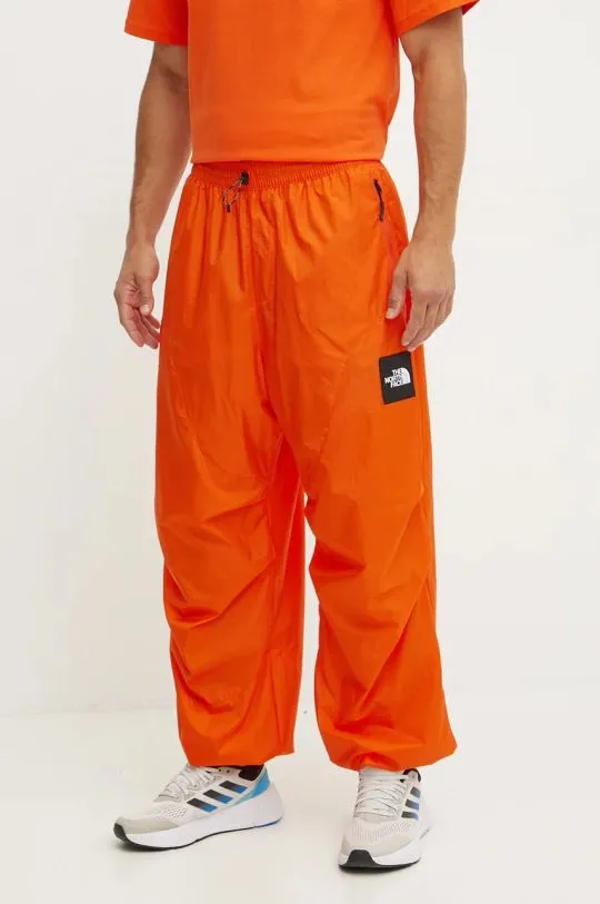 The North Face trousers TNF x Yinka Ilori orange color with an application NF0A89GPA6M1