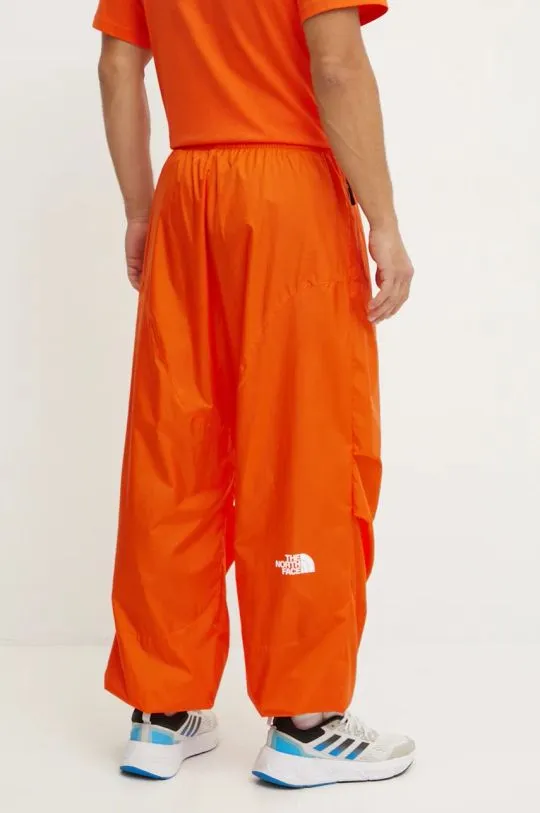 The North Face trousers TNF x Yinka Ilori orange color with an application NF0A89GPA6M1