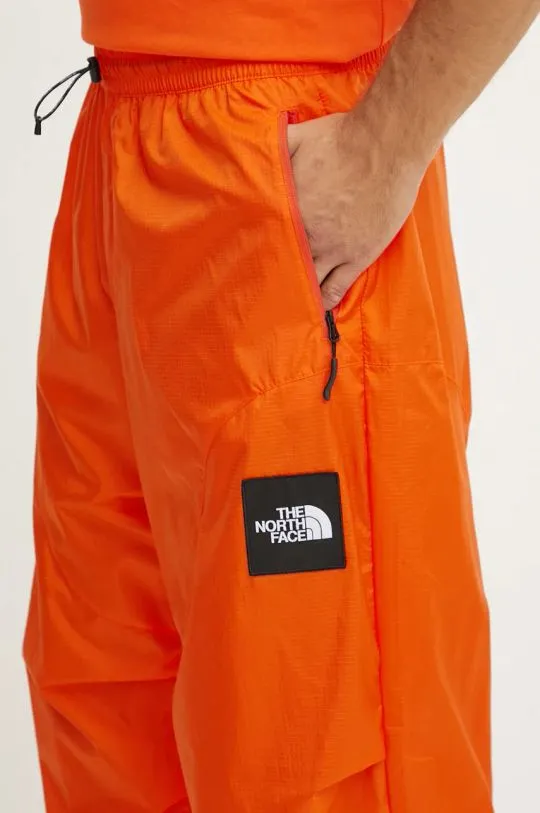 The North Face trousers TNF x Yinka Ilori orange color with an application NF0A89GPA6M1